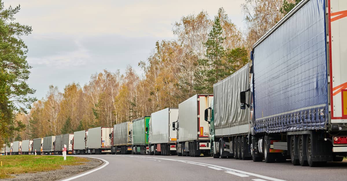 A line of delivery trucks. | Patrick Daniel Law