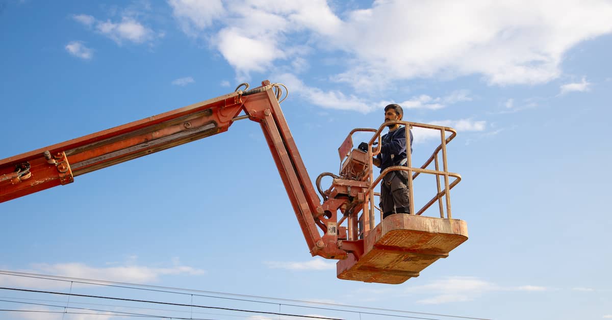 worker operating aerial lift