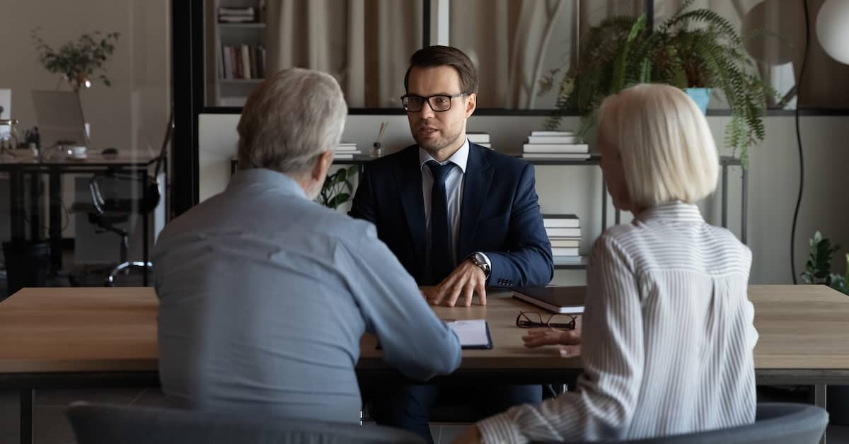 Truck wreck attorney talking to client couple. | Patrick Daniel Law